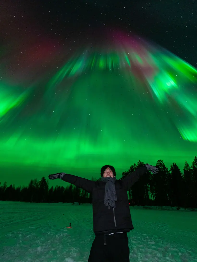 Guest under an aurora corona filling the whole sky